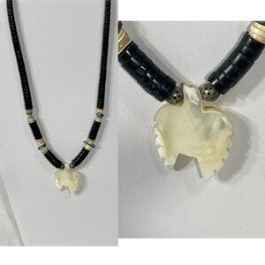 1970's shell, jet and turquoise graduated heishi necklace with pendant.